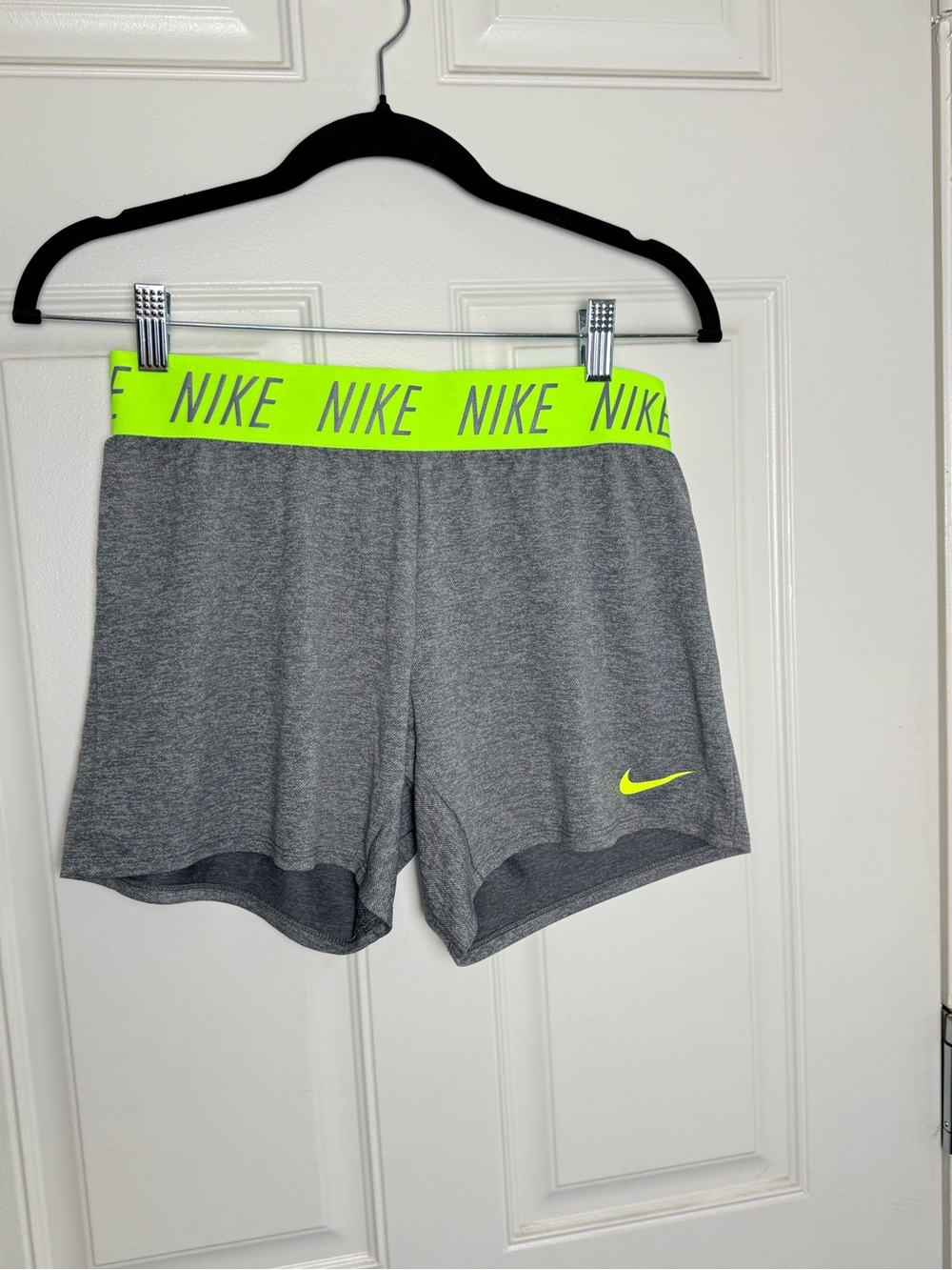 Nike Women's Gray Athletic Shorts with Neon Yellow Waistband and Swoosh